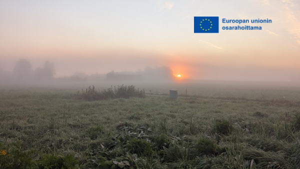 sykysinen auringonnousumaisema,EU-lipputunnus. 